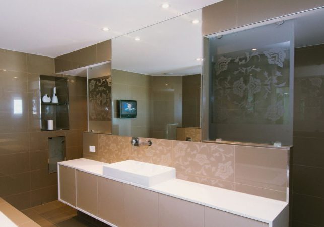 Large-Frameless-Bathroom-Mirror-above-a-vanity